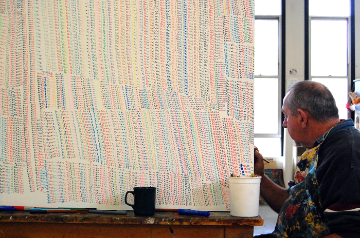 image of john demos working as his canvas