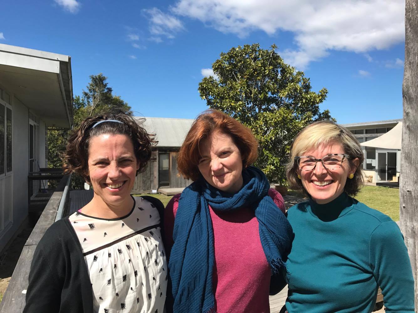 Kate Matairavula, Sofya Gollan (mentor) and Sue Jo Wright stand close together outside, smiling