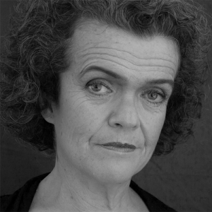 black and white headshot of a woman with mid length dark hair