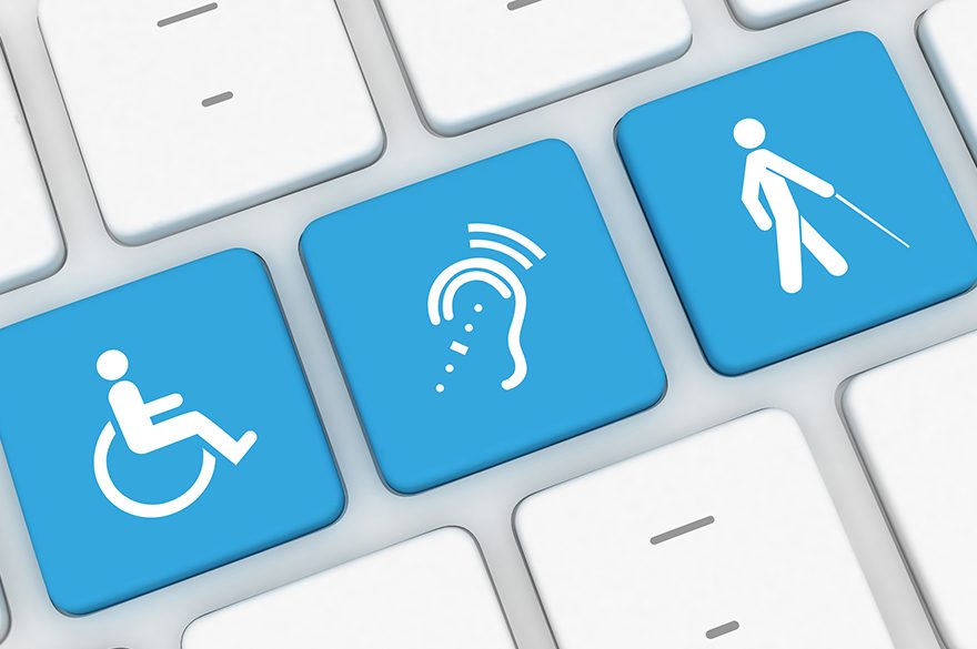 3 accessibility symbols in white on blue keys on a computer keyboard
