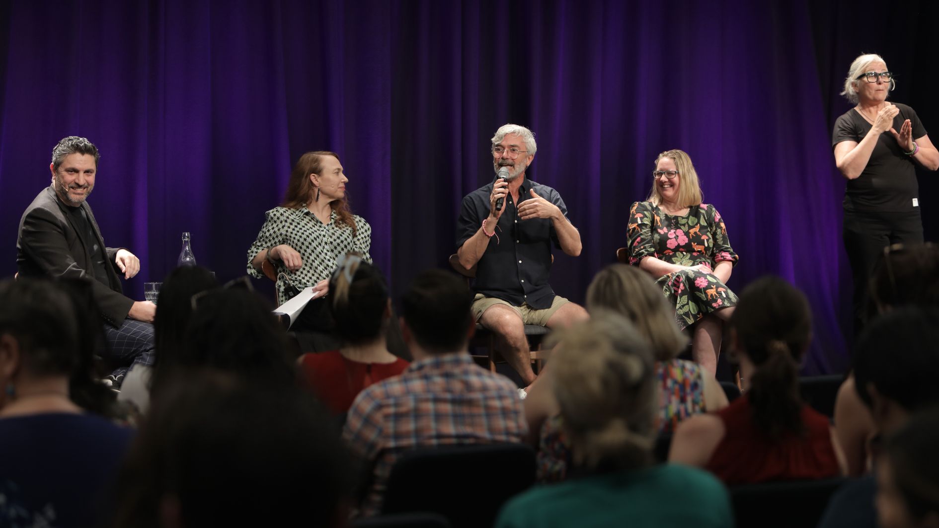 Build Your Audience panel discussion being Auslan interpreted. Photo by Dieter Knierim.